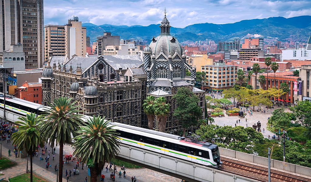 Medellín city skyline with metro and historic architecture
